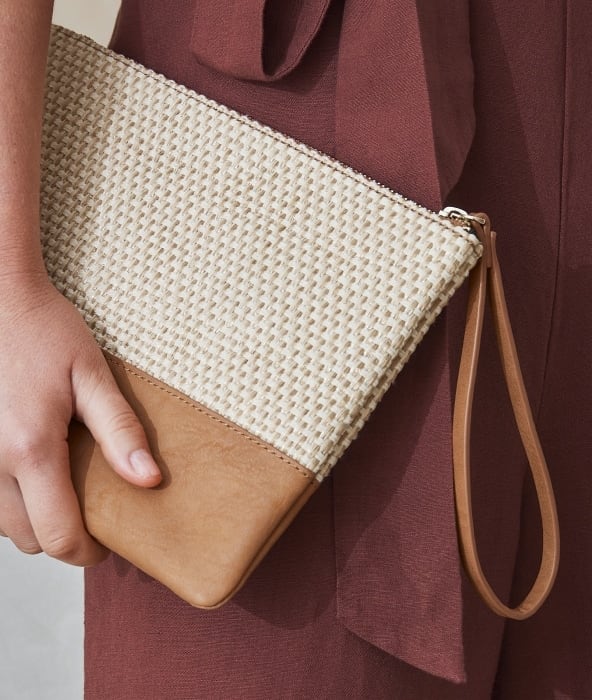 Summer Essentials Woman holding bag.